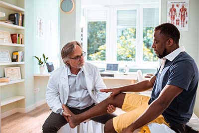 Young man going to the doctor for pain