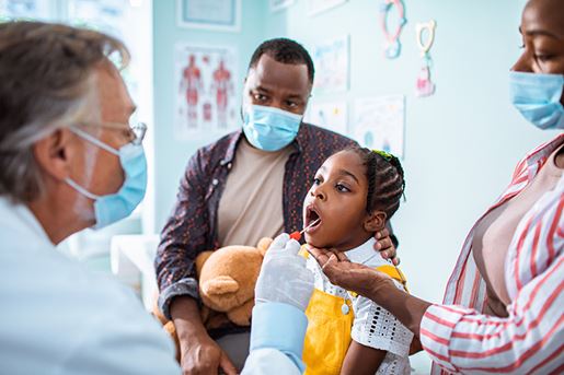 Close up of a pediatrician having a medical exam done on his patient.