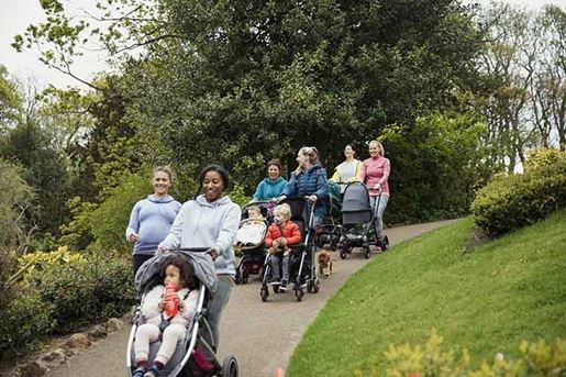 mother and baby exercise in park